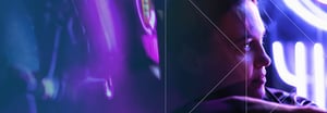 The profile view of a person bathed in purple light